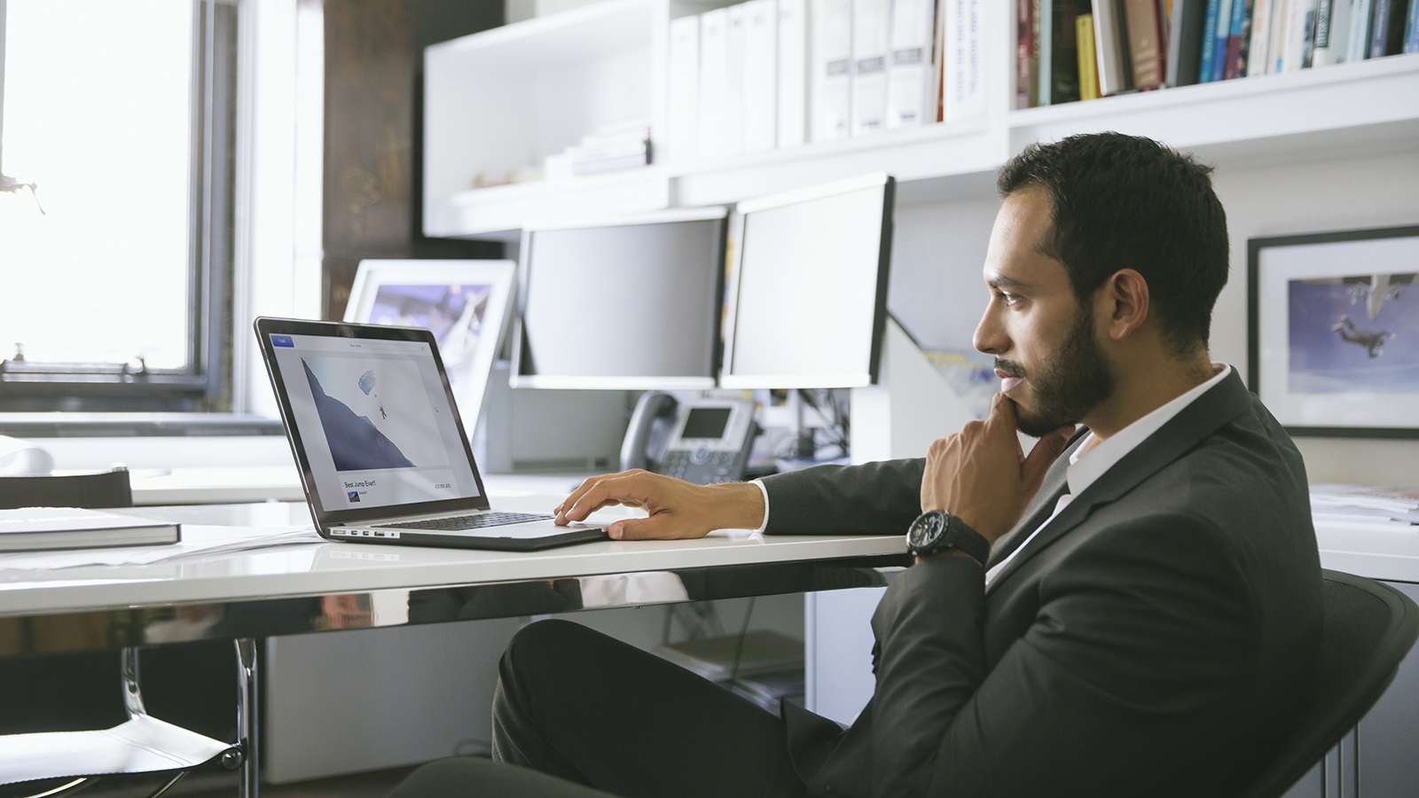 Man at desk using laptop. Man at desk using laptop.